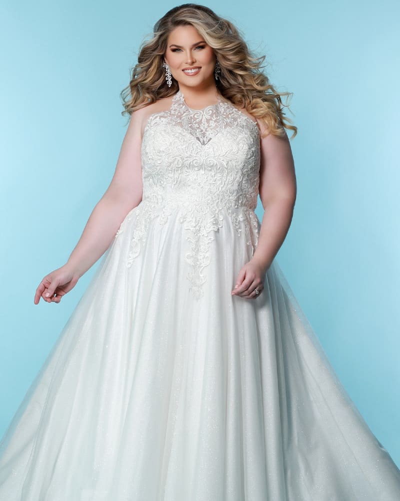 Front of a model wearing a size 24 Roxanne Wedding Dress in Ivory by Sydney's Closet. | dia_product_style_image_id:286684